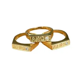 ANEL BAN. DOURADO ABC CRAV.