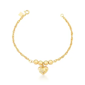PULSEIRA BAN. DOURADO LISO BOLINHA CORACAO PENDULO 18+5CM