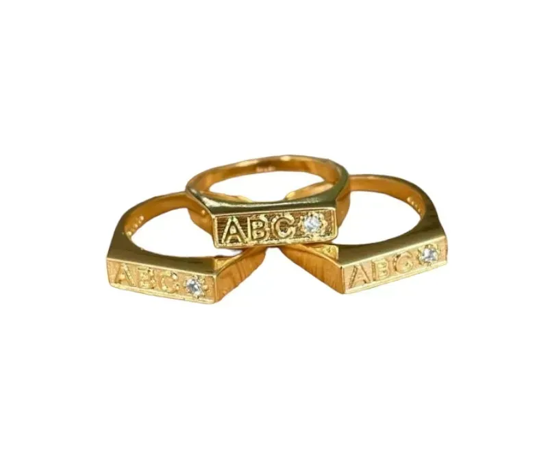 ANEL BAN. DOURADO ABC CRAV.