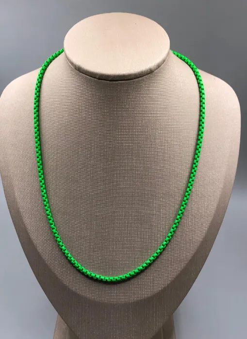 COLAR BAN. DOURADO VERDE FLORESCENTE